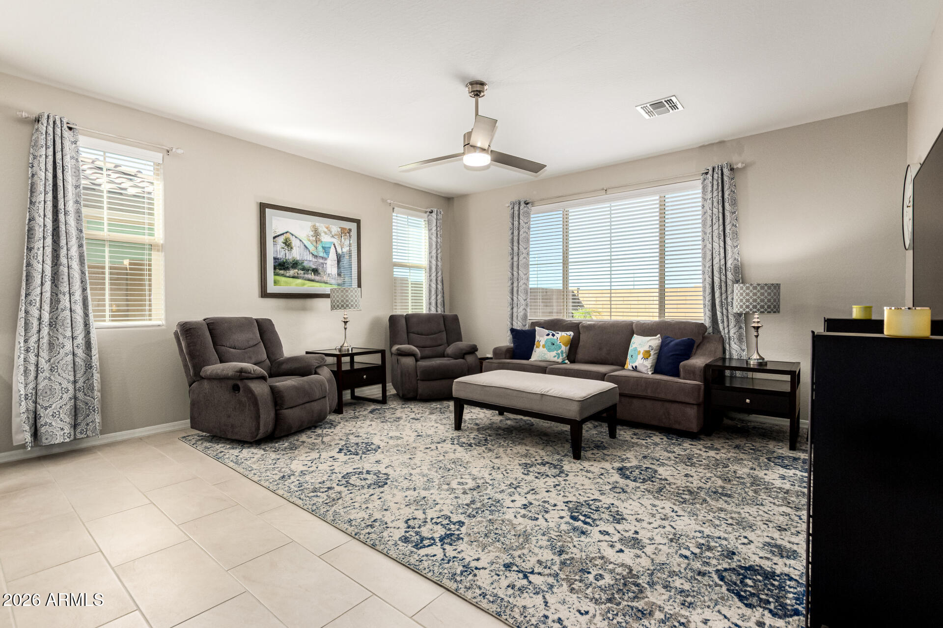 22494 East Russet Road Queen Creek, AZ 85142 - Photo 9 of 43 a living room with furniture and a chandelier