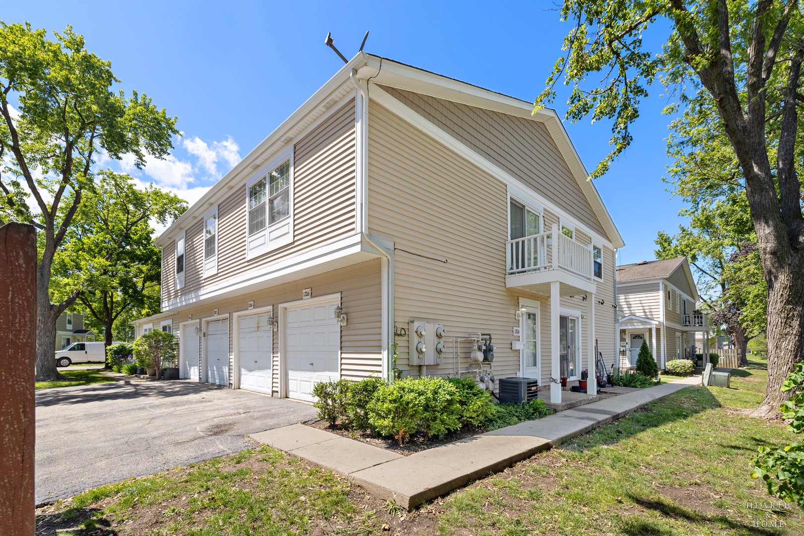 1206 Spur Court, Unit 1206 Wheeling, IL 60090 - Photo 1 of 1 a front view of a house with garden