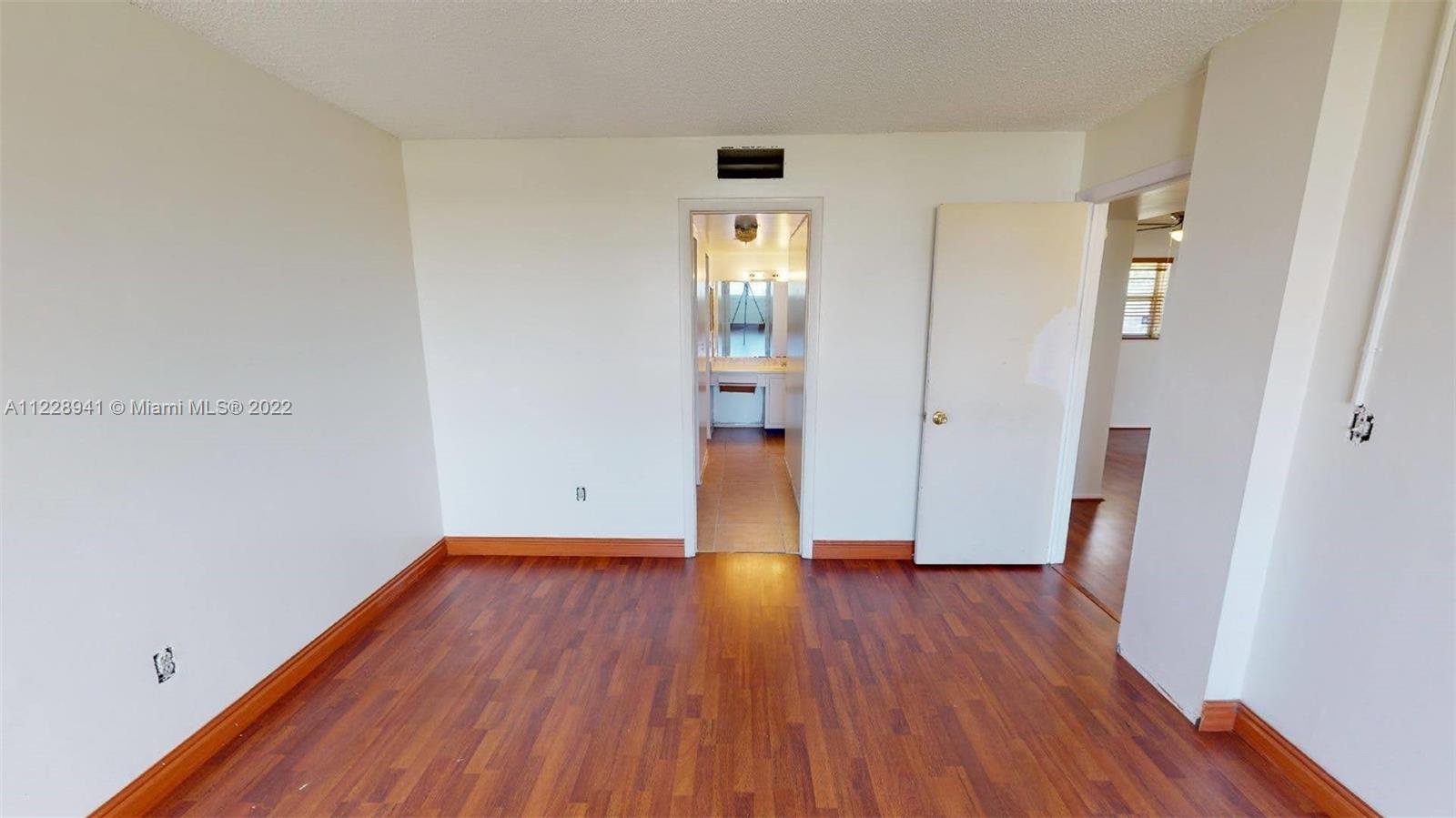 3490 Foxcroft Road, Unit B305 Miramar, FL 33025 - Photo 14 of 30 wooden floor in an empty room