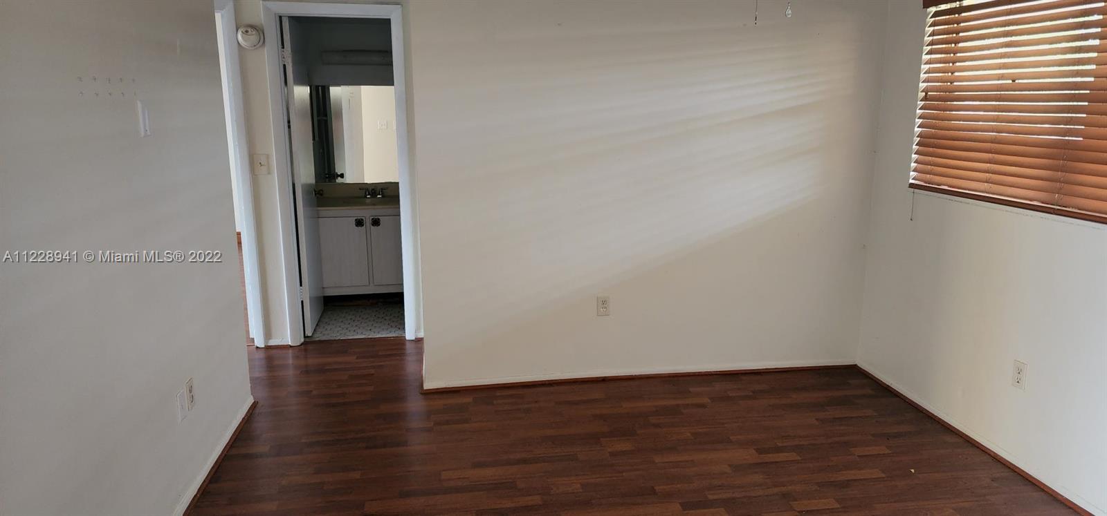 3490 Foxcroft Road, Unit B305 Miramar, FL 33025 - Photo 15 of 30 a view of hallway with wooden floor