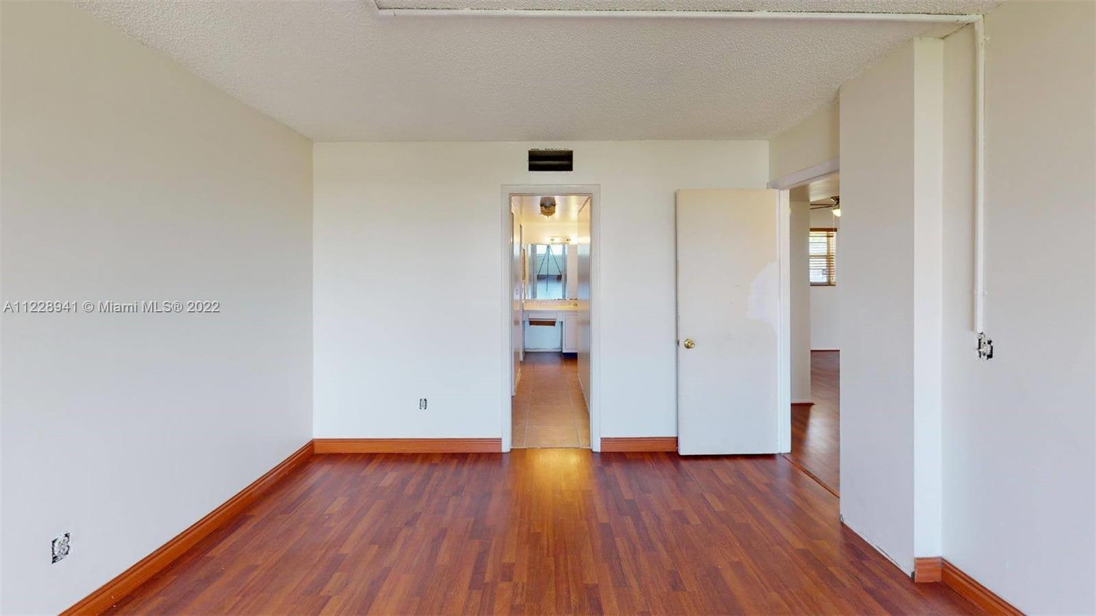3490 Foxcroft Road, Unit B305 Miramar, FL 33025 - Photo 21 of 30 wooden floor in an empty room