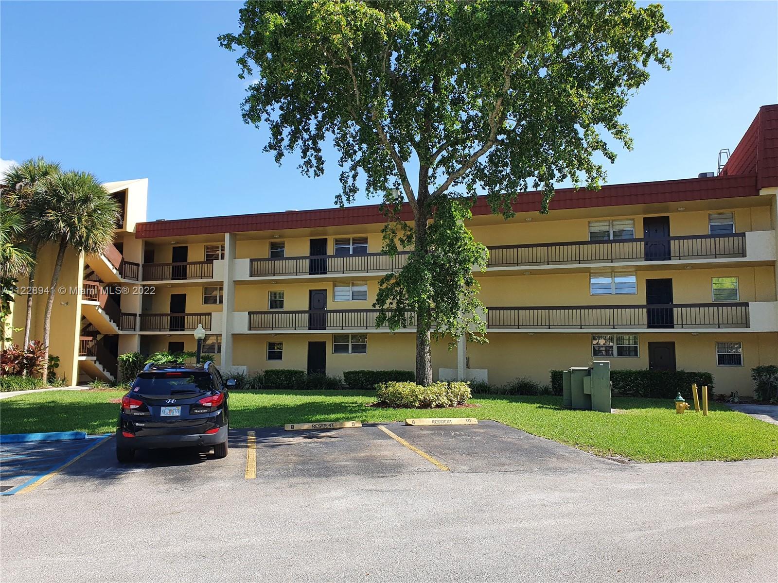 3490 Foxcroft Road, Unit B305 Miramar, FL 33025 - Photo 26 of 30 a car parked in front of a house