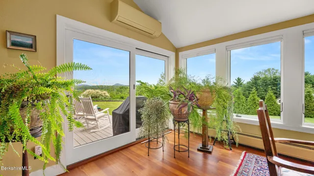 a living room view with furniture and a potted plant