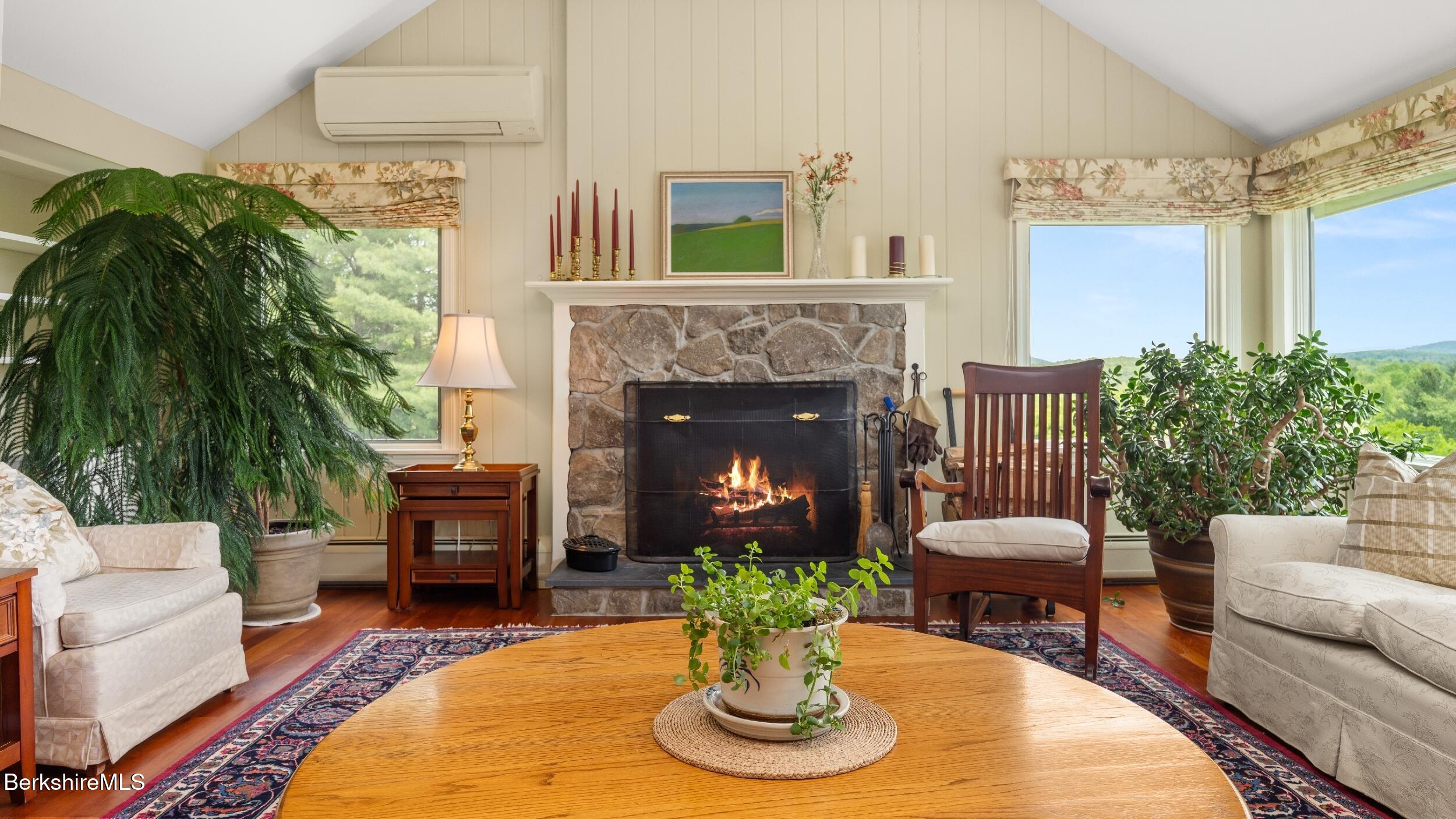 24 Baldwin Hill Road East Egremont, MA 01230 - Photo 16 of 47 a living room with furniture potted plant and a fireplace