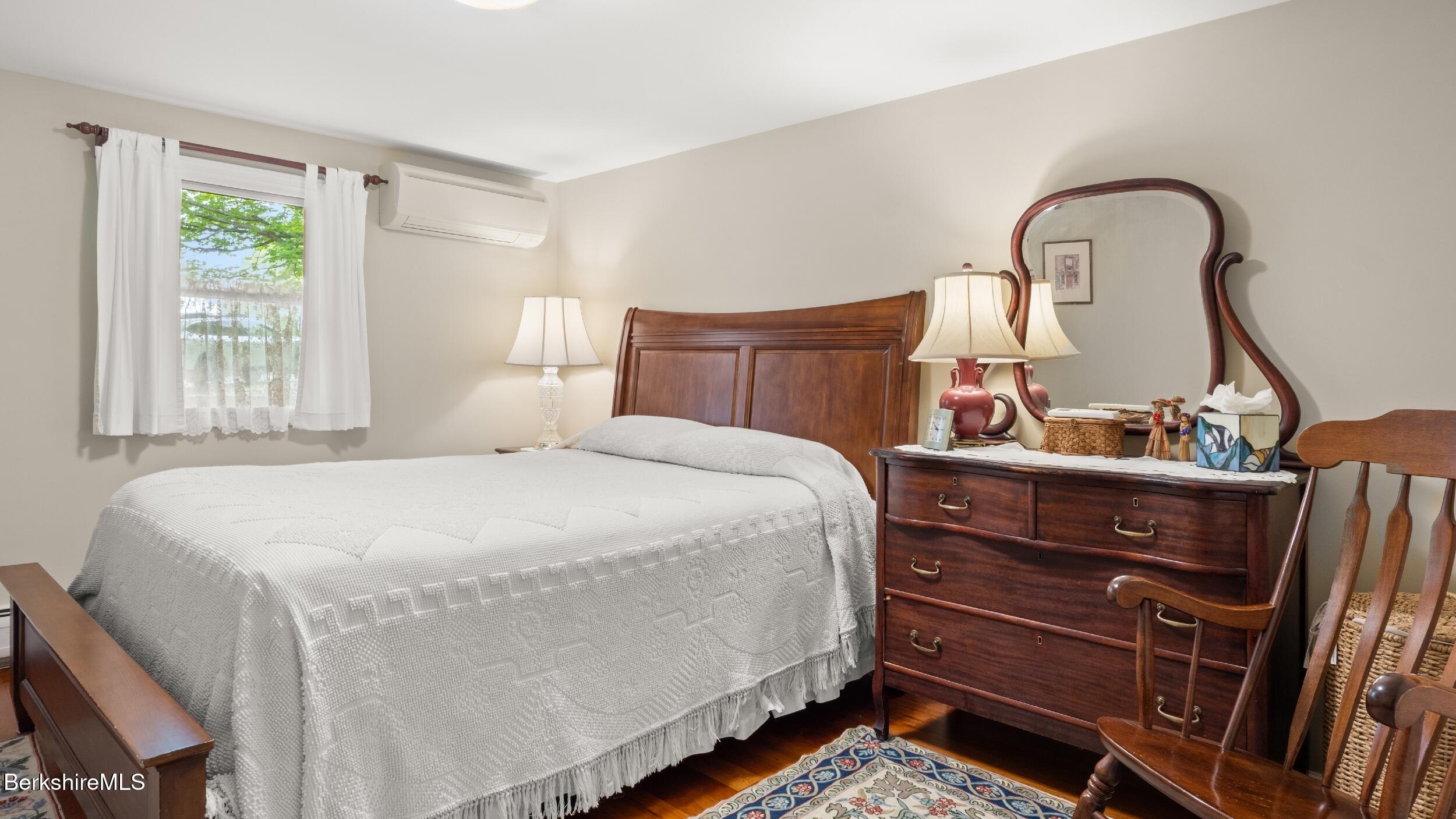 24 Baldwin Hill Road East Egremont, MA 01230 - Photo 25 of 47 a bed sitting in a bedroom next to a window