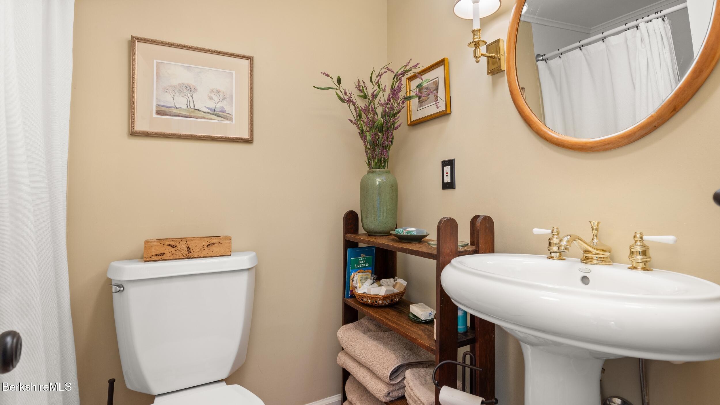 24 Baldwin Hill Road East Egremont, MA 01230 - Photo 26 of 47 a bathroom with a toilet a sink and a mirror