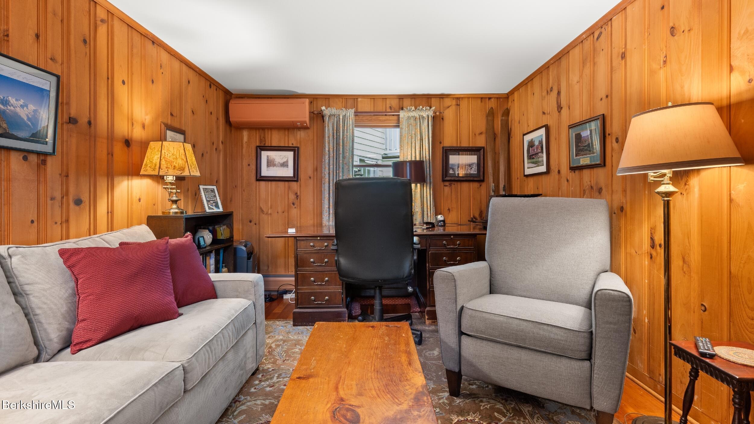 24 Baldwin Hill Road East Egremont, MA 01230 - Photo 27 of 47 a living room with furniture fireplace and a large window
