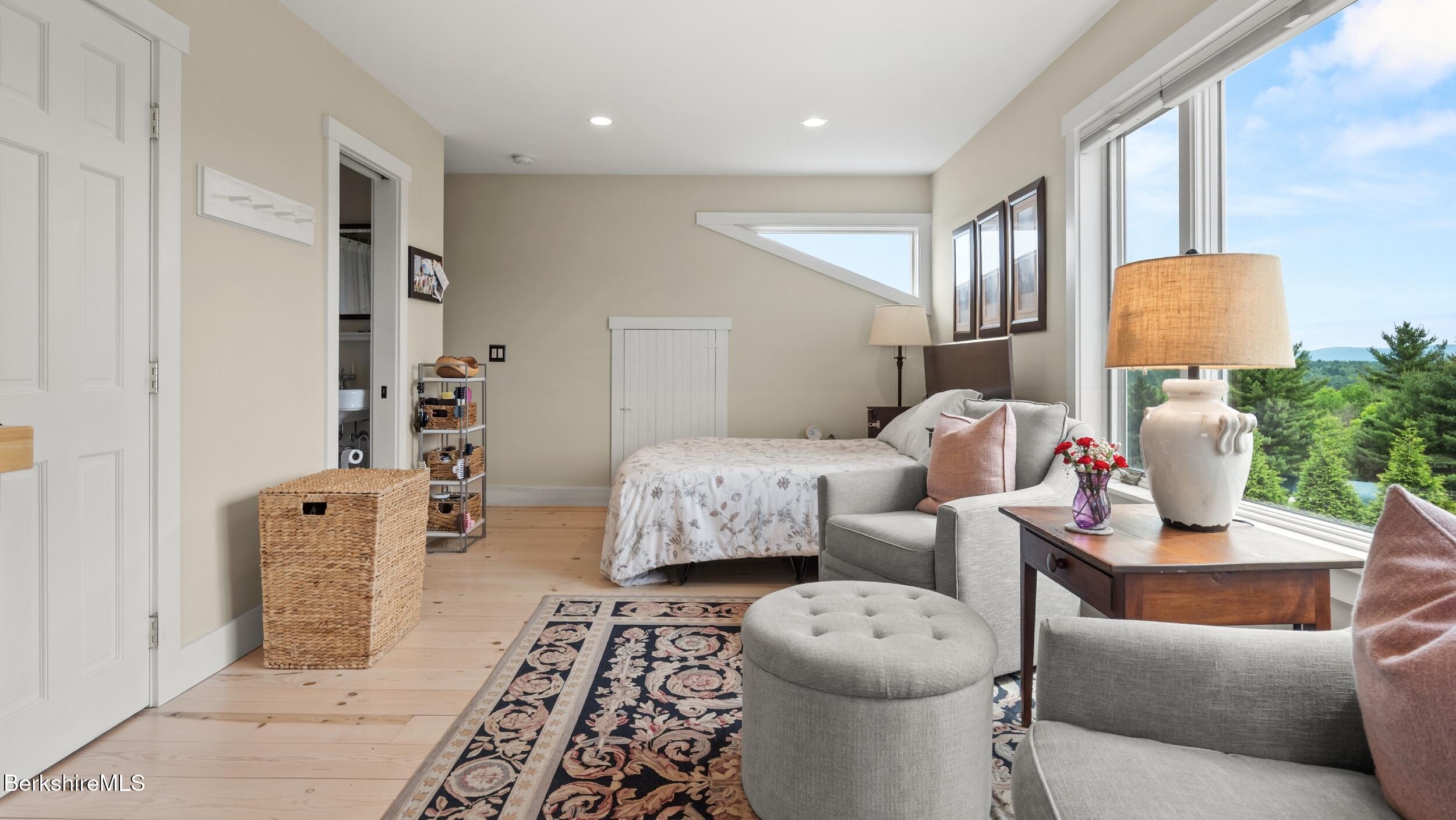 24 Baldwin Hill Road East Egremont, MA 01230 - Photo 30 of 47 a living room with furniture a mirror and a lamp