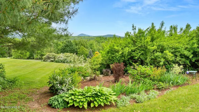 a view of a garden with a building in front of it