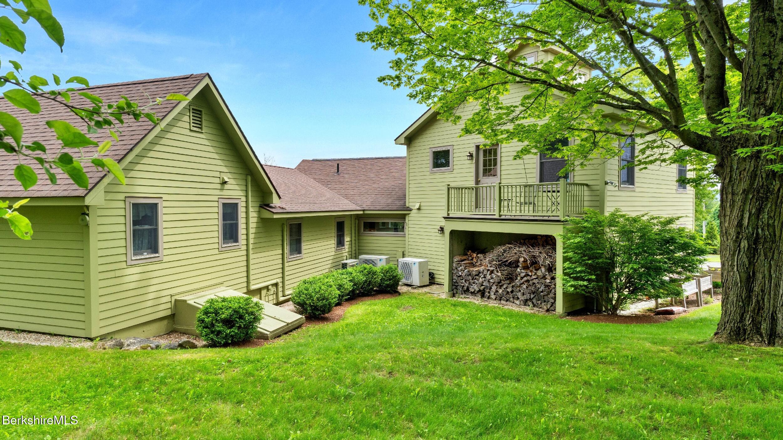 24 Baldwin Hill Road East Egremont, MA 01230 - Photo 41 of 47 a front view of a house with a garden and yard
