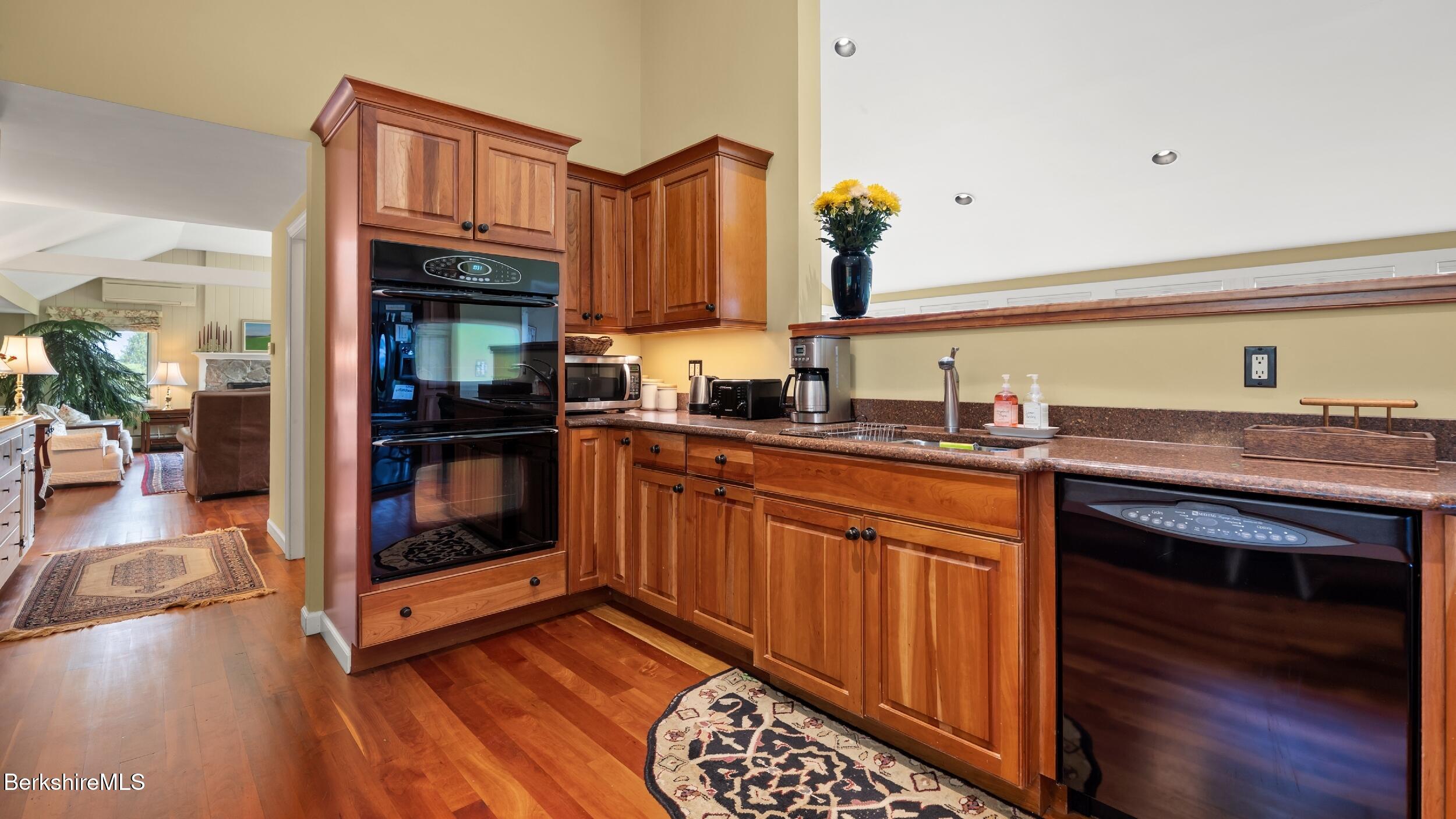 24 Baldwin Hill Road East Egremont, MA 01230 - Photo 9 of 47 a kitchen with stainless steel appliances granite countertop a sink stove and cabinets