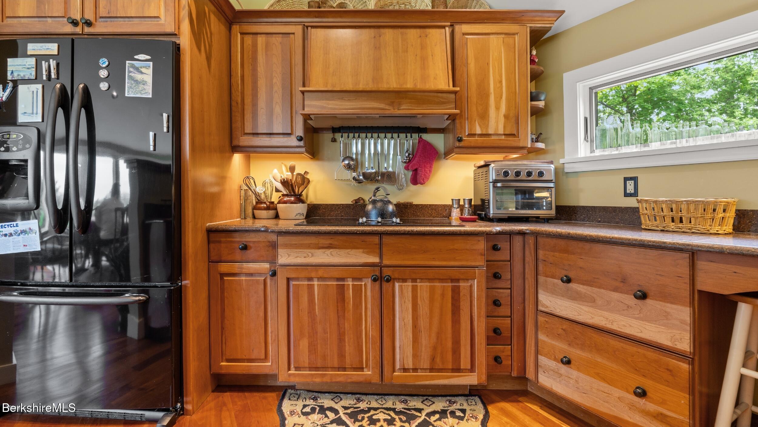 24 Baldwin Hill Road East Egremont, MA 01230 - Photo 10 of 47 a kitchen with stainless steel appliances granite countertop a coffee maker on granite counter tops and a window