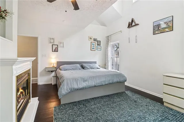 a bedroom with a bed and a fireplace