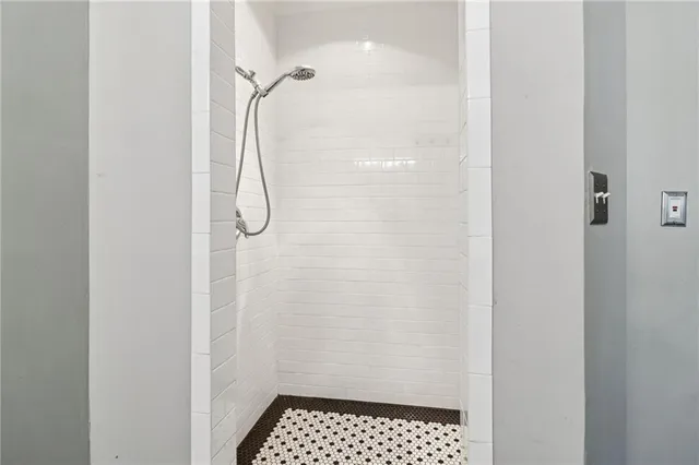 a bathroom with a glass shower door