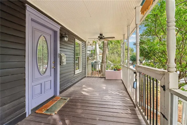a view of a porch with wooden floor and stairs