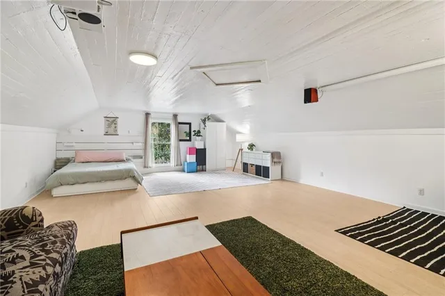 a bedroom with a bed and a dresser