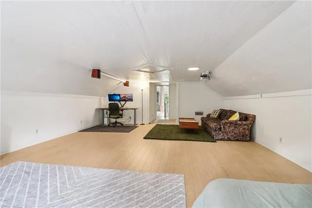 a bed room with a bed furniture and a chandelier