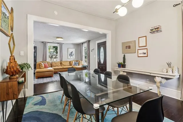 a view of a dining room with furniture and a livingroom