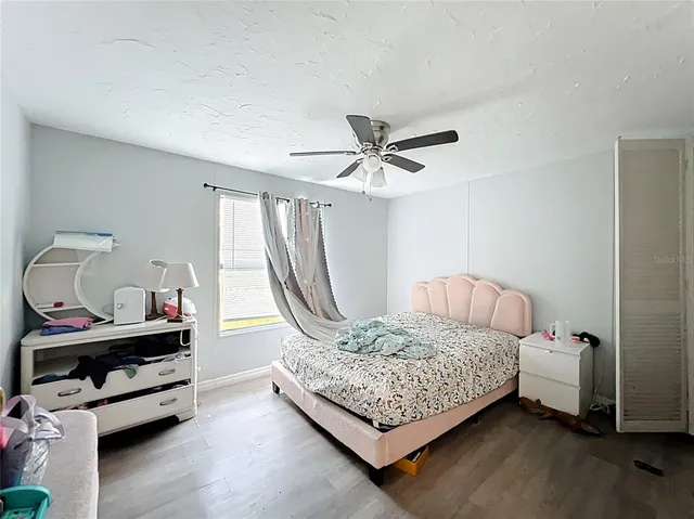 a bed room with a bed and a window