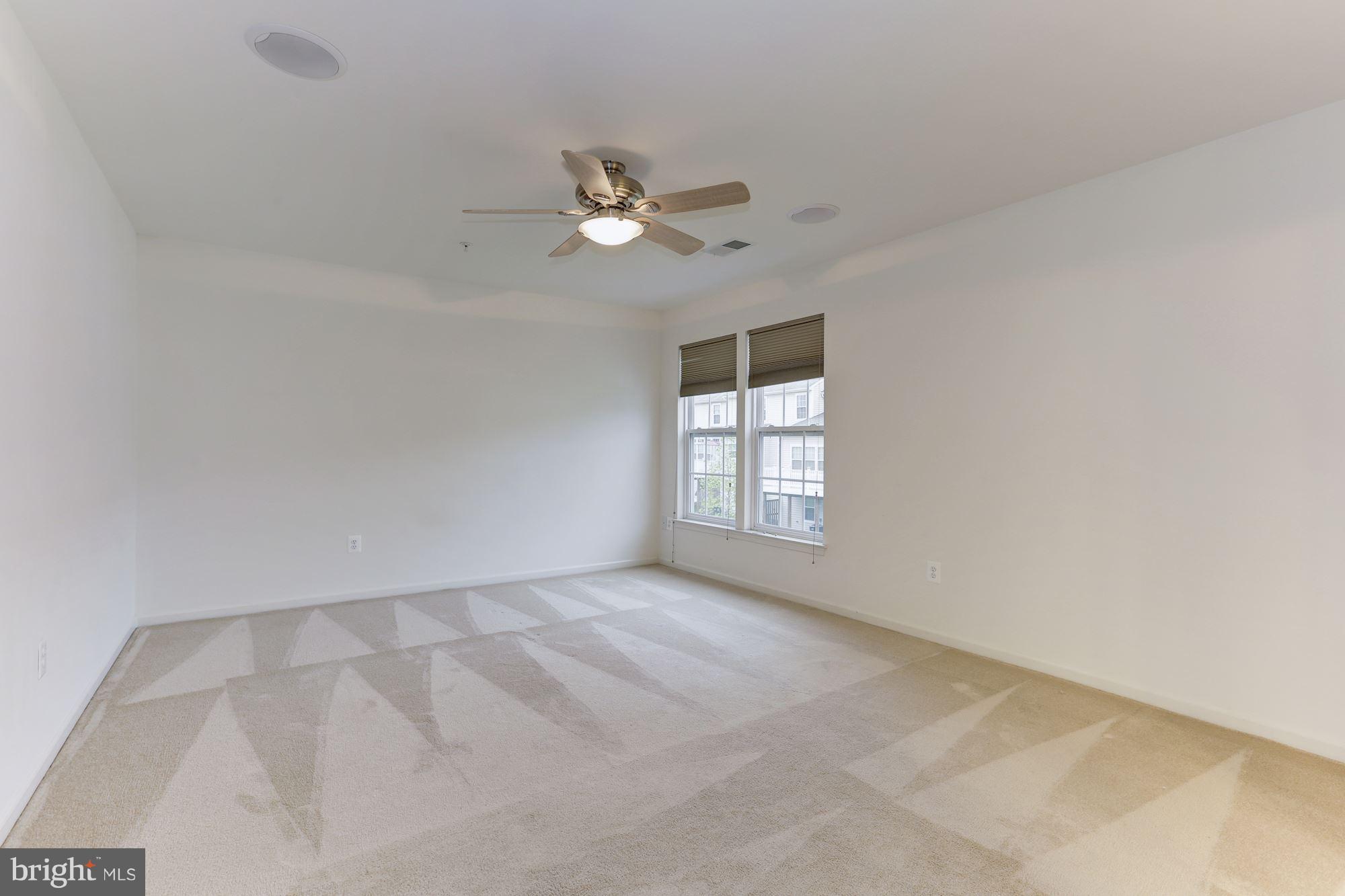 7522 Helston Court Hanover, MD 21076 - Photo 18 of 30 a view of an empty room with a window