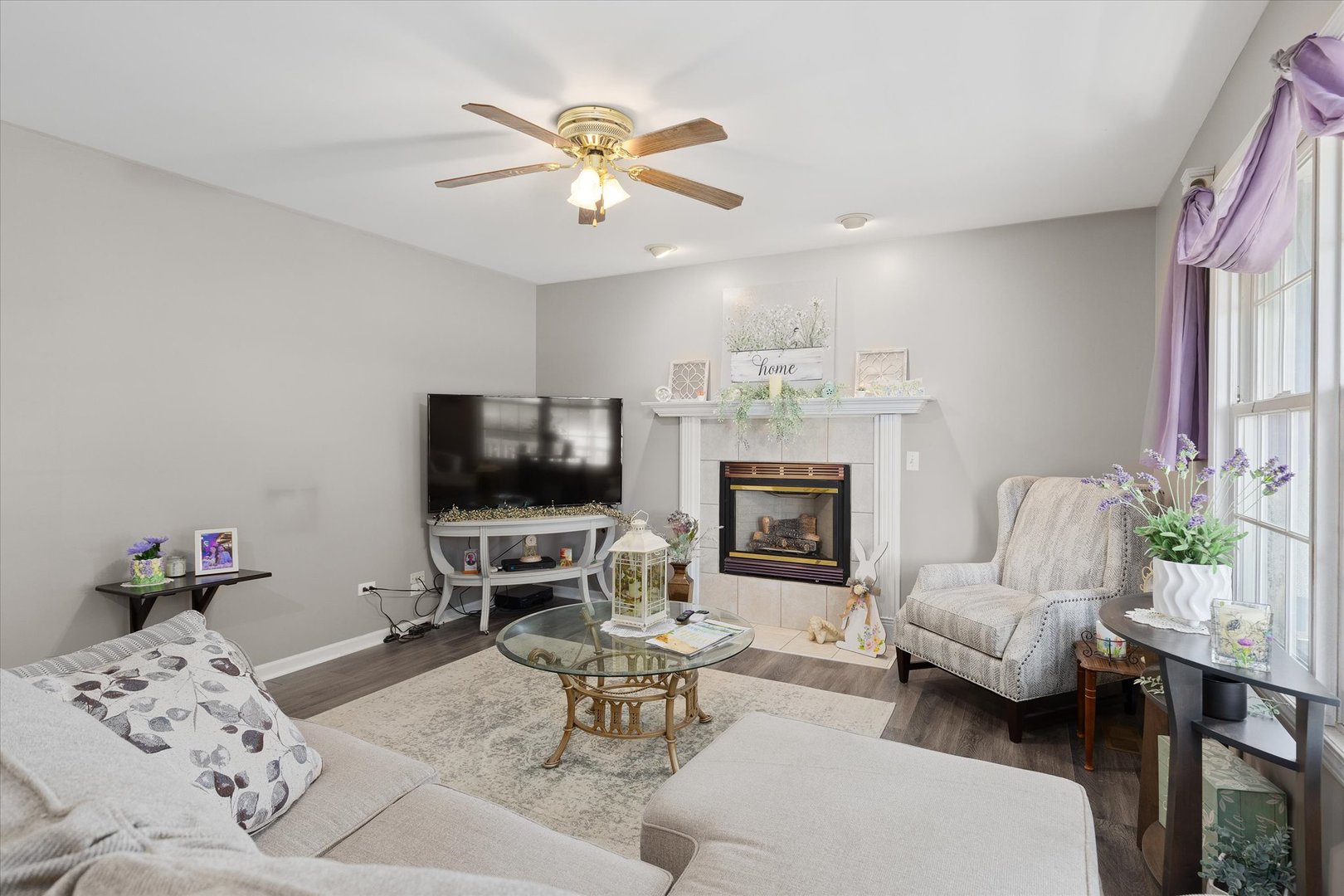 2697 Creekside Lane Morris, IL 60450 - Photo 5 of 31 a living room with furniture a fireplace and a flat screen tv
