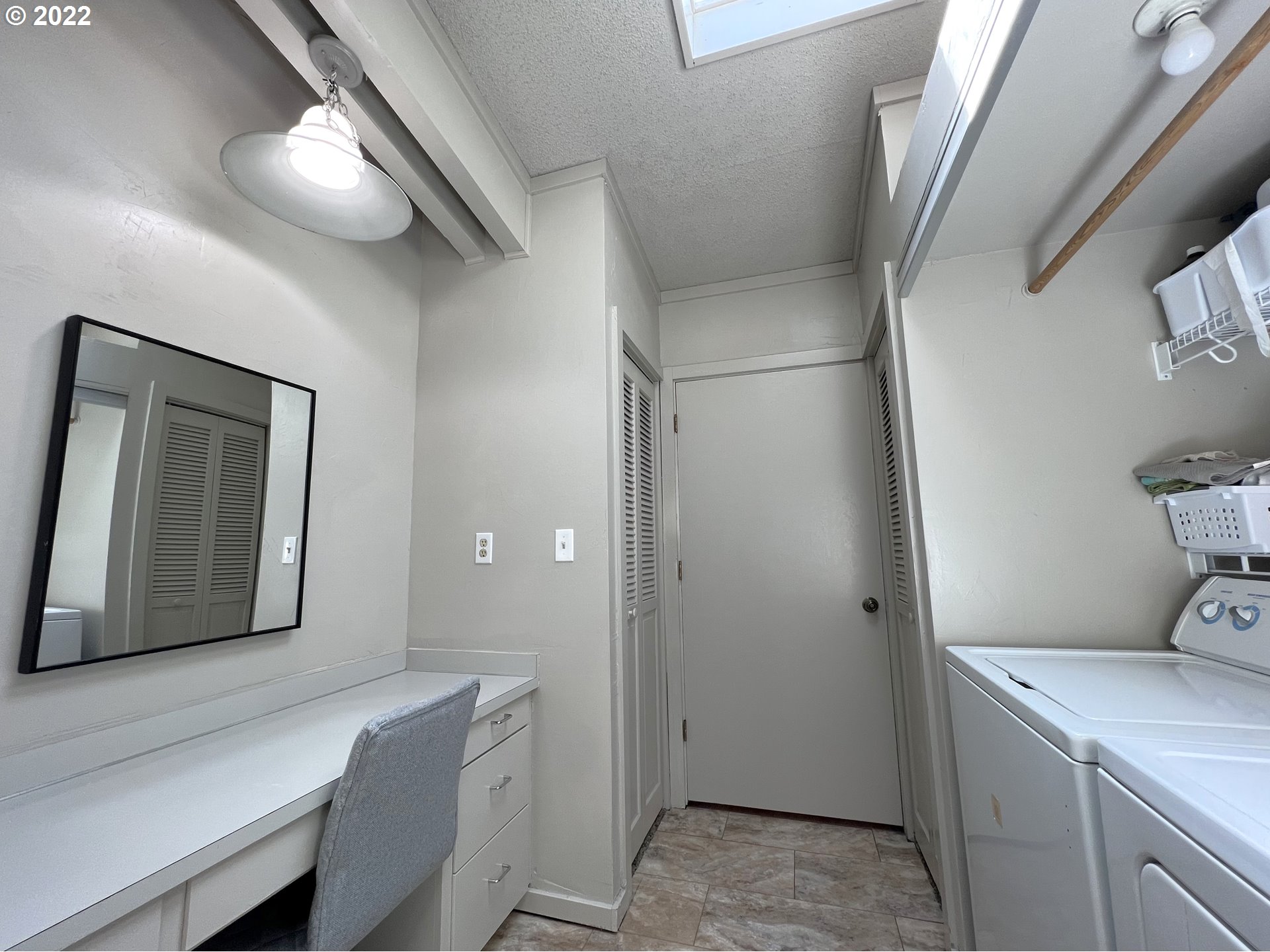 2690 Everett Avenue North Bend, OR 97459 - Photo 20 of 32 a room with a refrigerator and a dresser