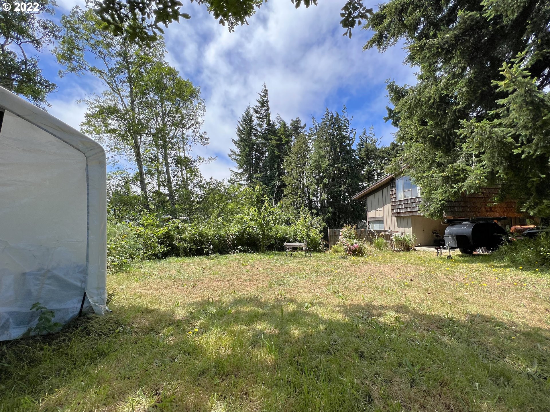 2690 Everett Avenue North Bend, OR 97459 - Photo 23 of 32 a backyard of a house with lots of green space