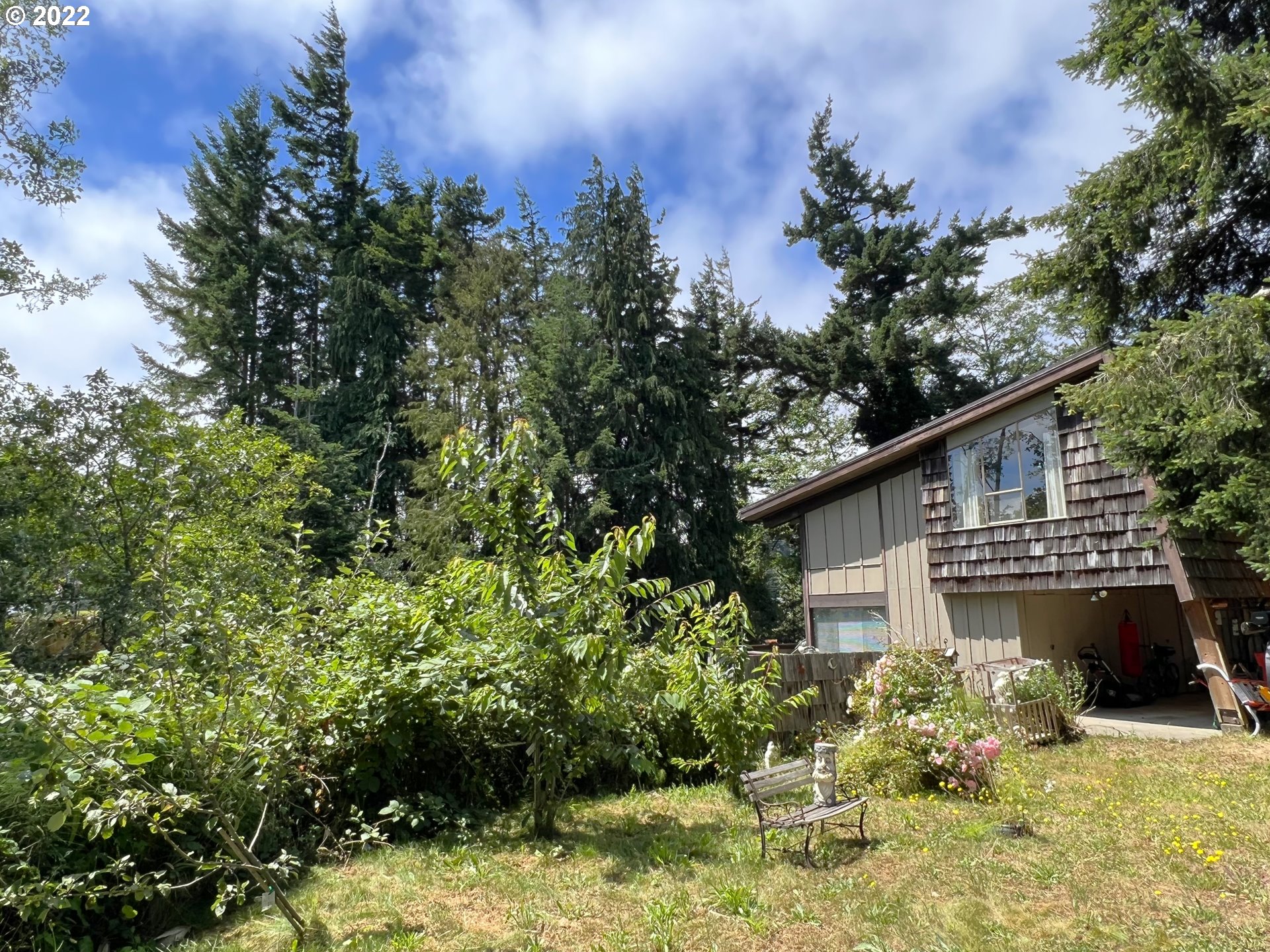 2690 Everett Avenue North Bend, OR 97459 - Photo 24 of 32 a backyard of a house with lots of green space