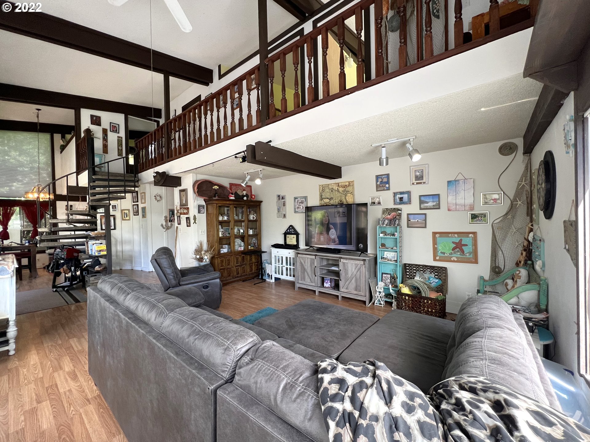 2690 Everett Avenue North Bend, OR 97459 - Photo 8 of 32 a living room with furniture and a flat screen tv