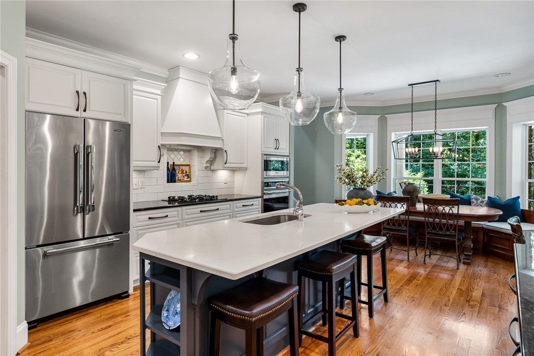 200 Graylyn Drive Anderson, SC 29621 - Photo 10 of 48 Culinary aspirations meet everyday ease in this luminous kitchen, complete with a generous island and a cozy dining nook.