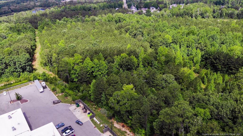 24-87 Nc Cameron, NC 28326 - Photo 16 of 28 an aerial view of a house with a yard