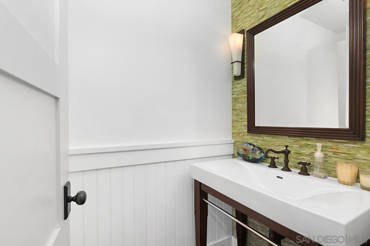 5524 Candlelight Drive La Jolla, CA 92037 - Photo 13 of 27 a bathroom with a sink and a mirror