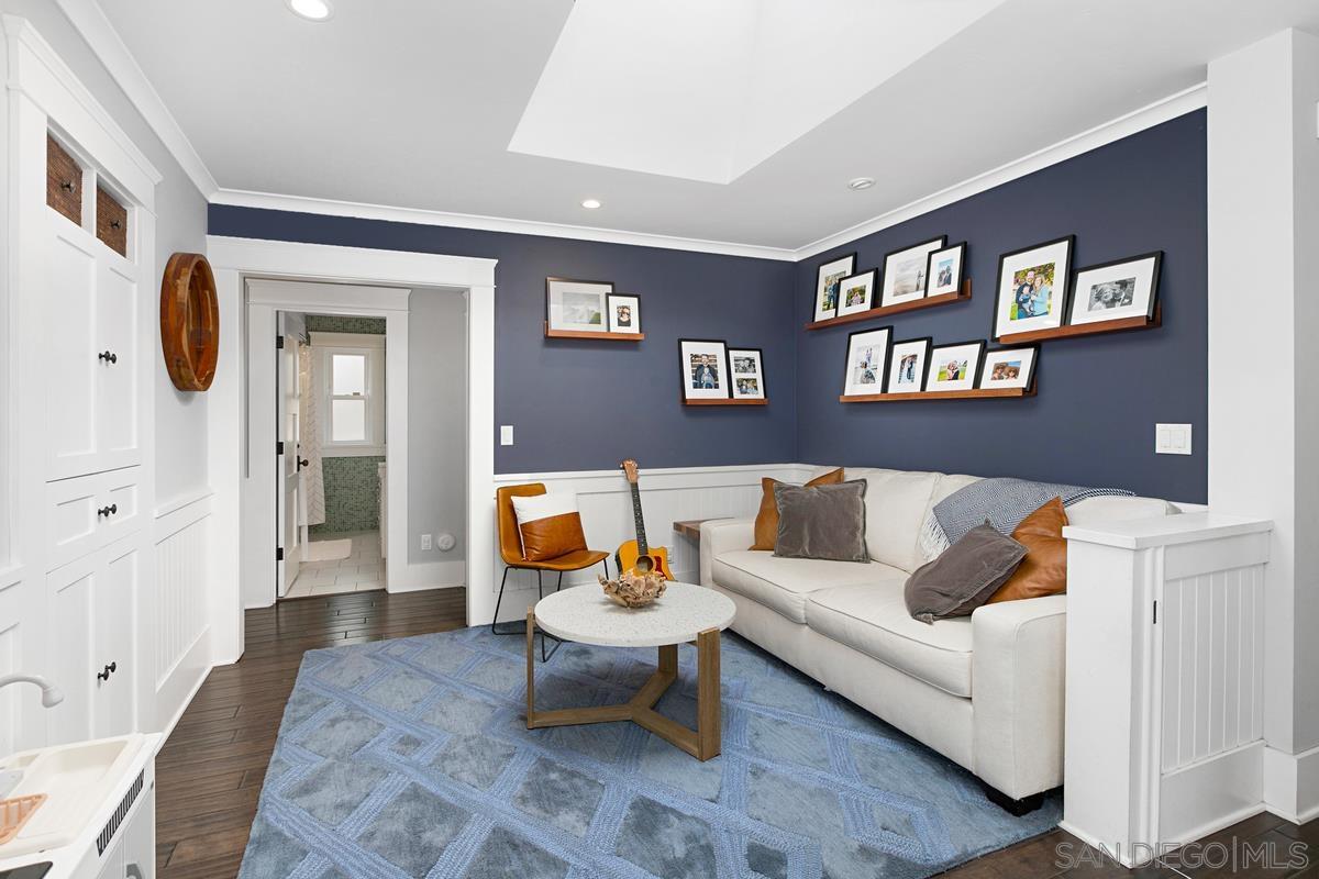 5524 Candlelight Drive La Jolla, CA 92037 - Photo 14 of 27 a living room with furniture and a painting on the wall