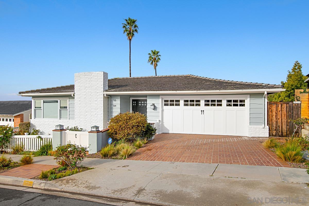 5524 Candlelight Drive La Jolla, CA 92037 - Photo 2 of 27 a front view of a house with a yard