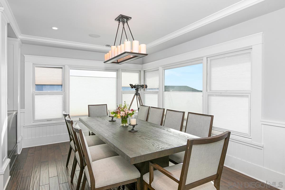 5524 Candlelight Drive La Jolla, CA 92037 - Photo 9 of 27 a view of a dining room with furniture window and wooden floor