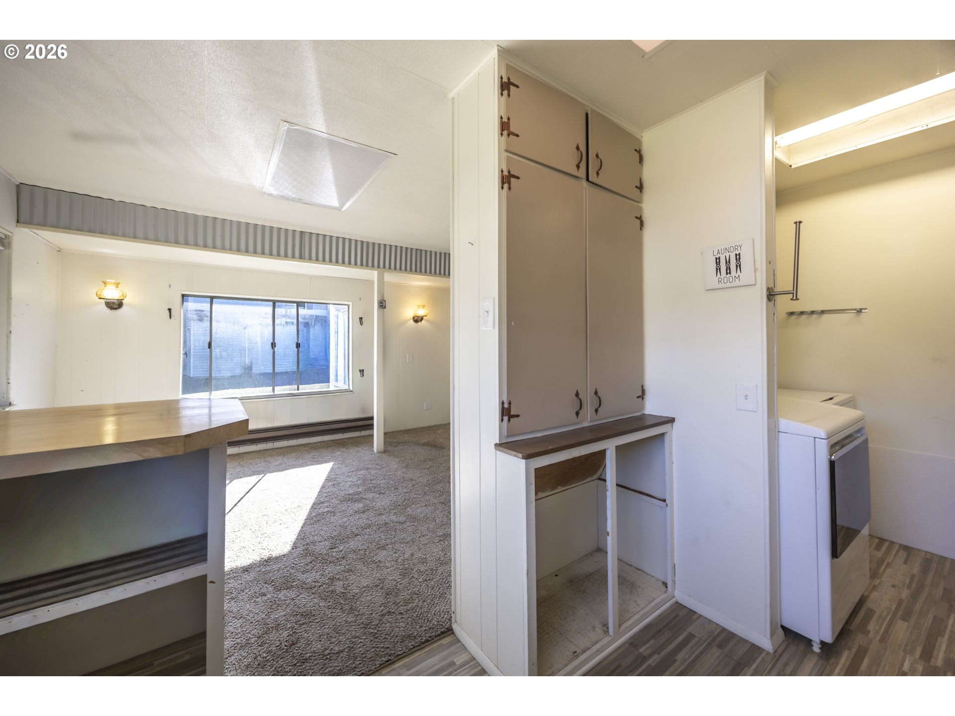 550 North 8th Street Lakeside, OR 97449 - Photo 11 of 31 a kitchen with stainless steel appliances a refrigerator and a stove