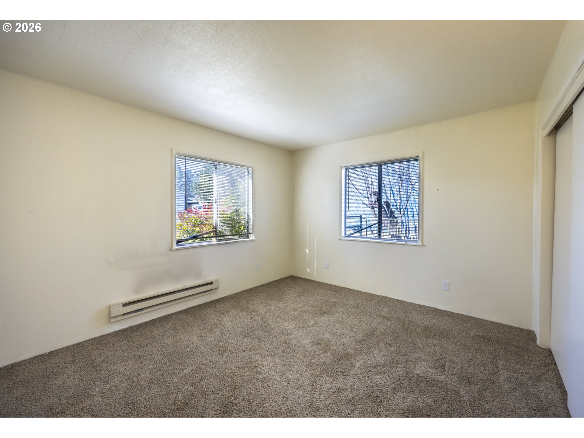 550 North 8th Street Lakeside, OR 97449 - Photo 14 of 31 an empty room with windows and closet
