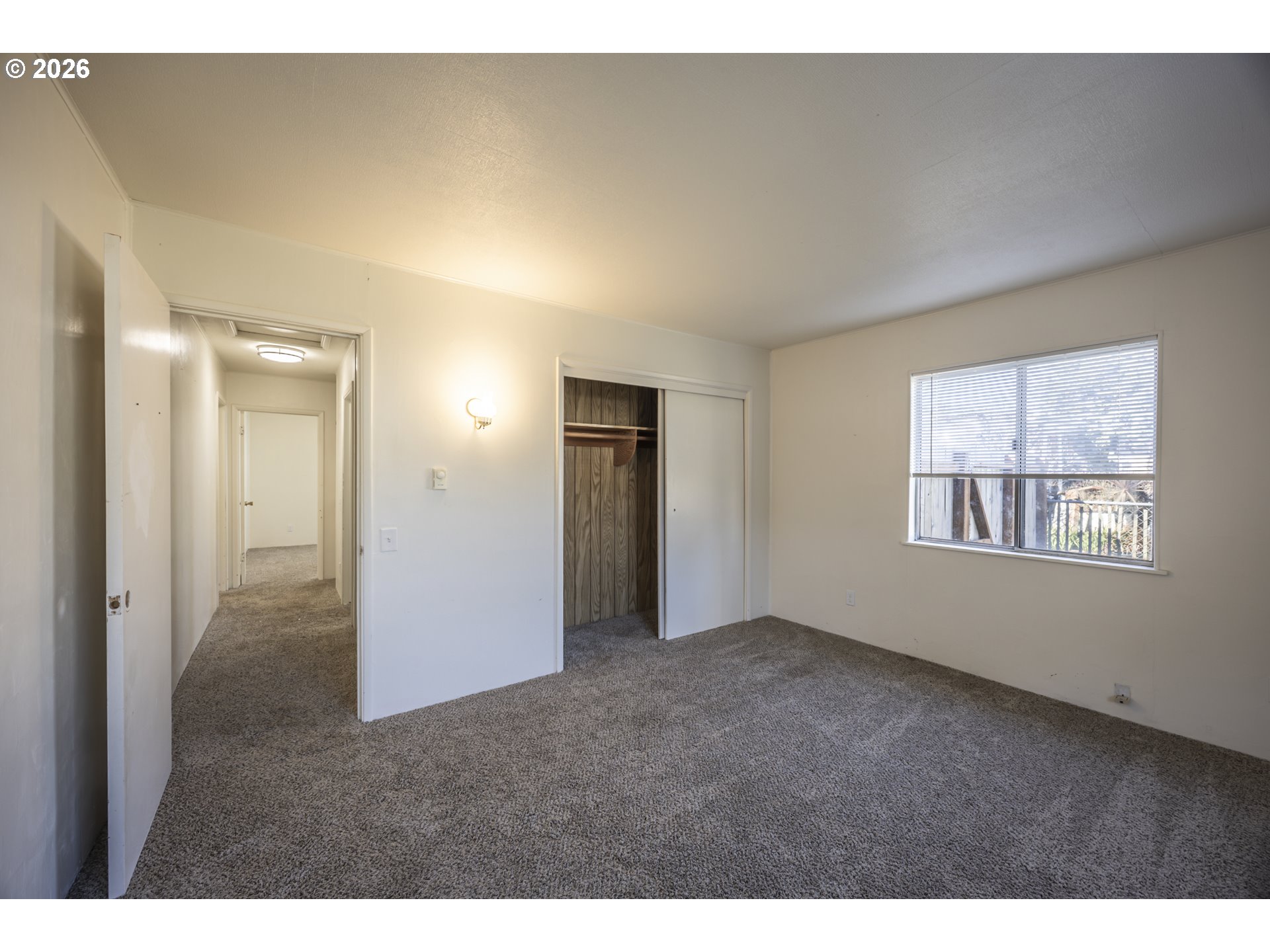 550 North 8th Street Lakeside, OR 97449 - Photo 19 of 31 a view of an empty room with window and hallway