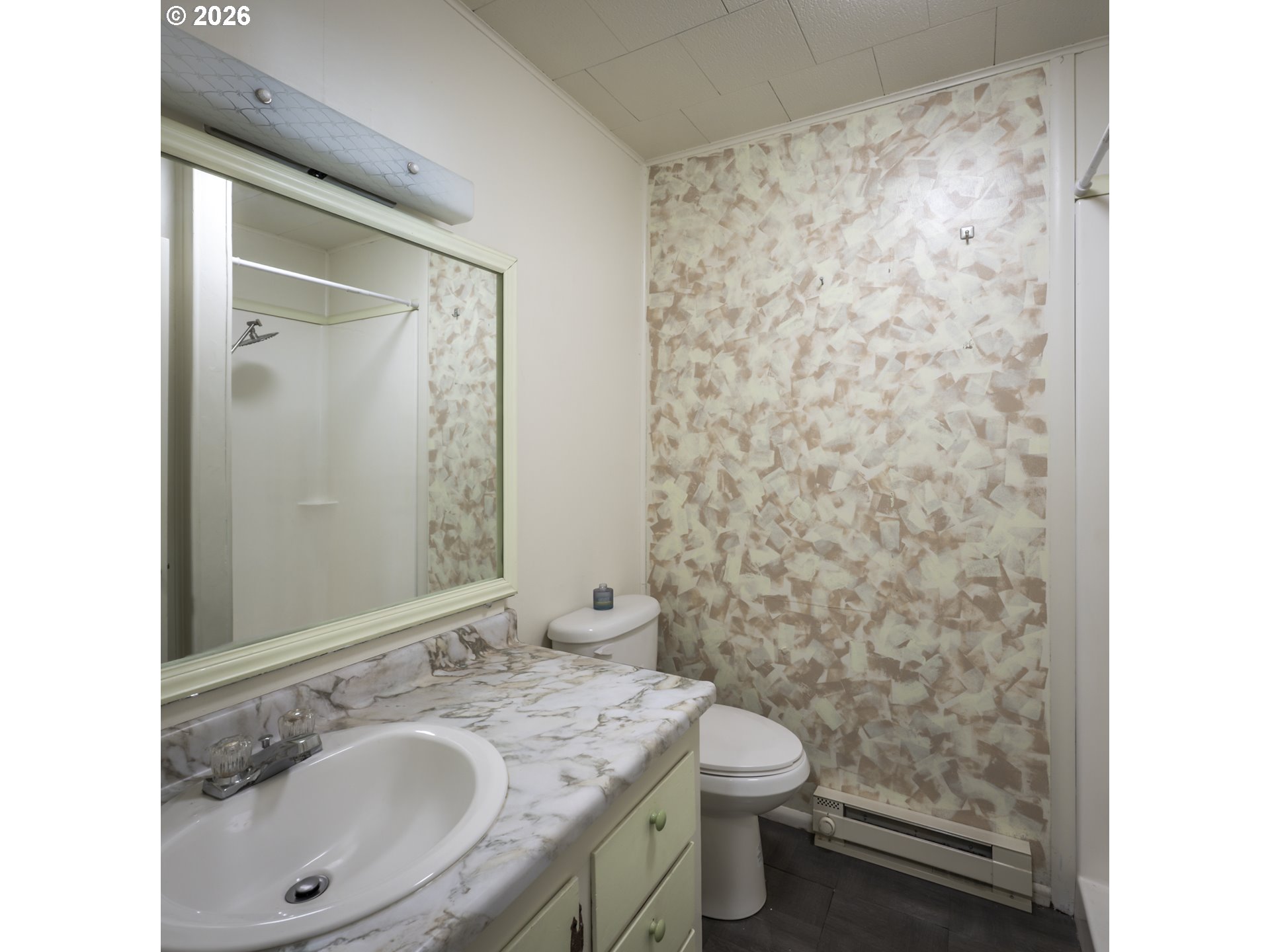 550 North 8th Street Lakeside, OR 97449 - Photo 21 of 31 a bathroom with a granite countertop sink toilet and shower