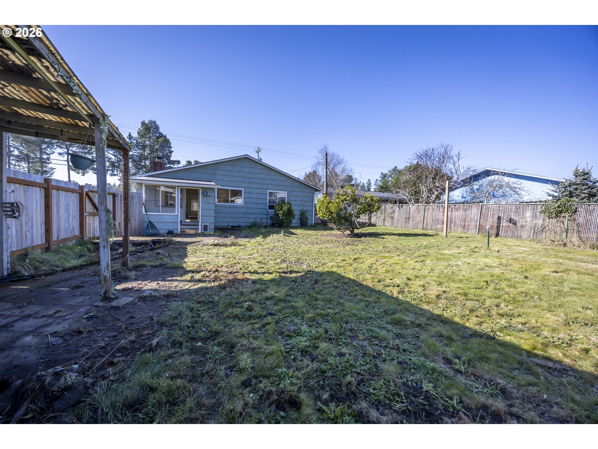 550 North 8th Street Lakeside, OR 97449 - Photo 25 of 31 a view of a house with a yard
