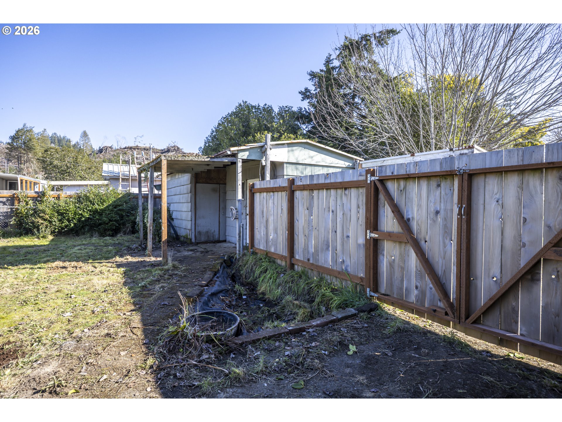 550 North 8th Street Lakeside, OR 97449 - Photo 31 of 31 a backyard of a house with lots of green space