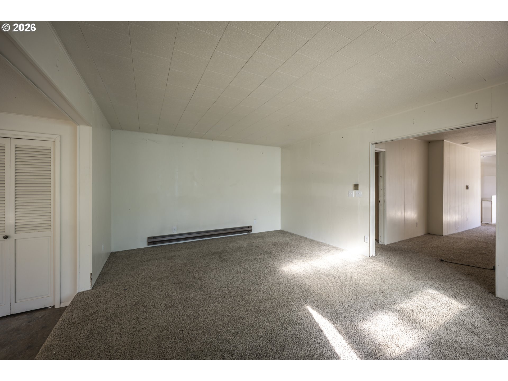 550 North 8th Street Lakeside, OR 97449 - Photo 8 of 31 a view of an empty room and window