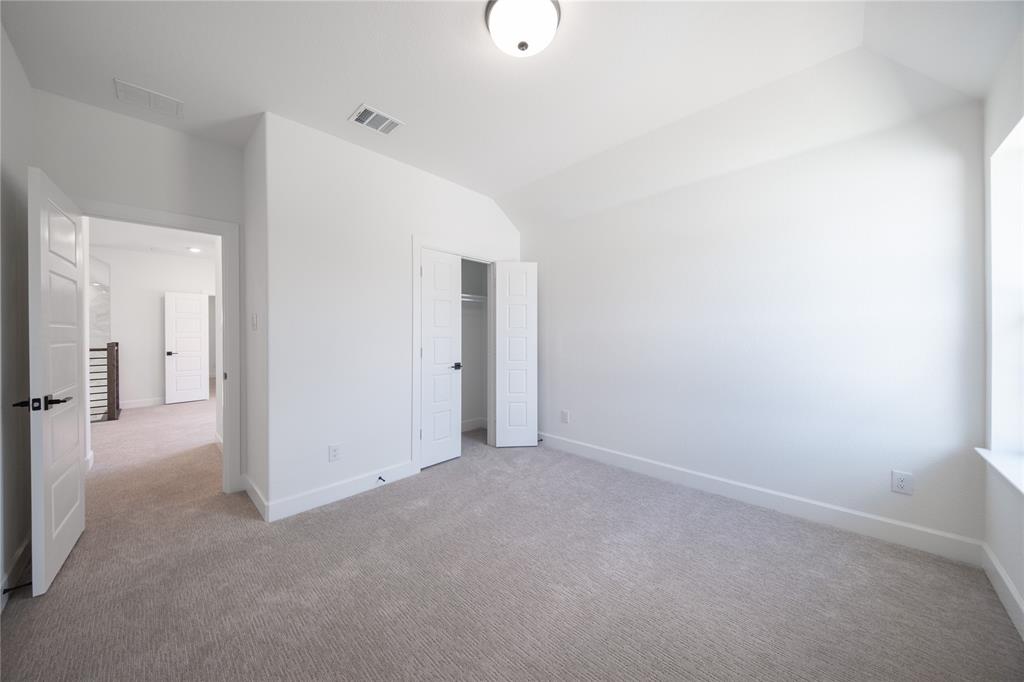 2719 Triumph Court Heath, TX 75126 - Photo 13 of 39 a view of a room with an empty space