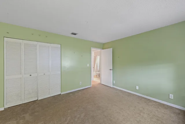 a bathroom with a sink a toilet a mirror a bathtub and shower