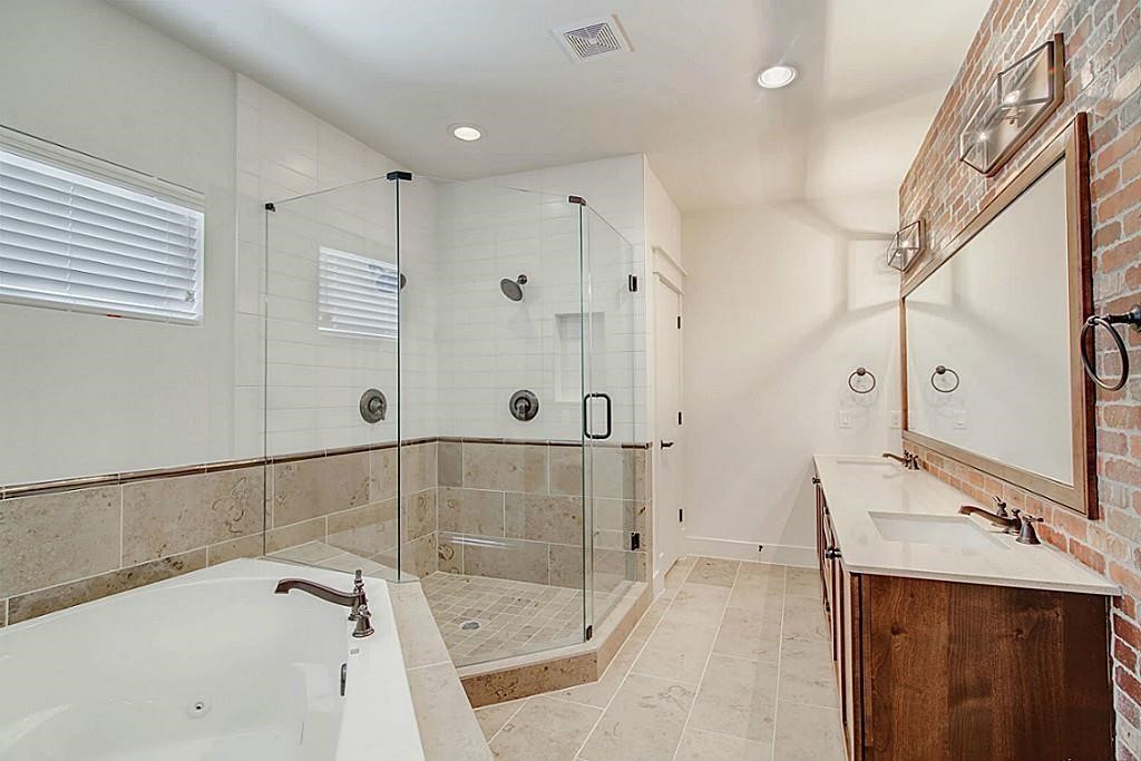 5810 Venice Street Houston, TX 77007 - Photo 17 of 31 a bathroom with a tub sink and mirror