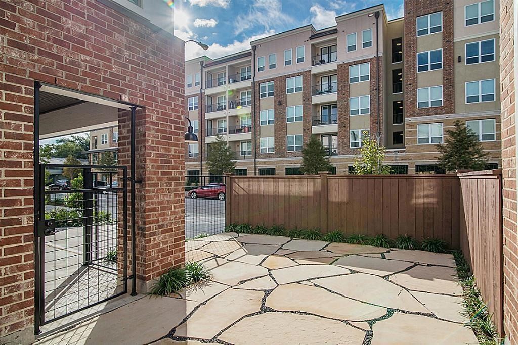 5810 Venice Street Houston, TX 77007 - Photo 4 of 31 a view of a brick building next to a yard