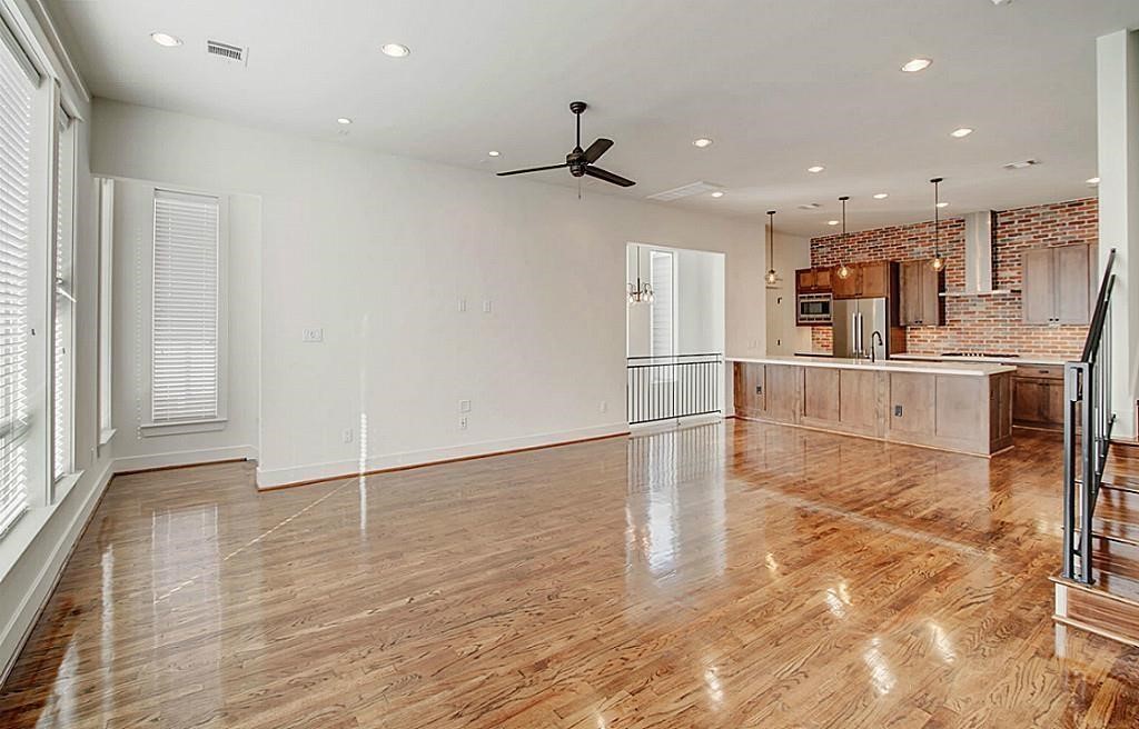 5810 Venice Street Houston, TX 77007 - Photo 9 of 31 a view of kitchen with cabinets and wooden floor