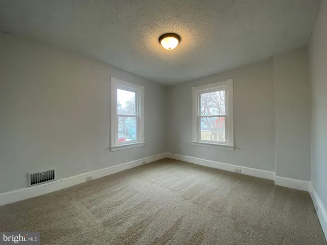 a view of swimming pool with a yard