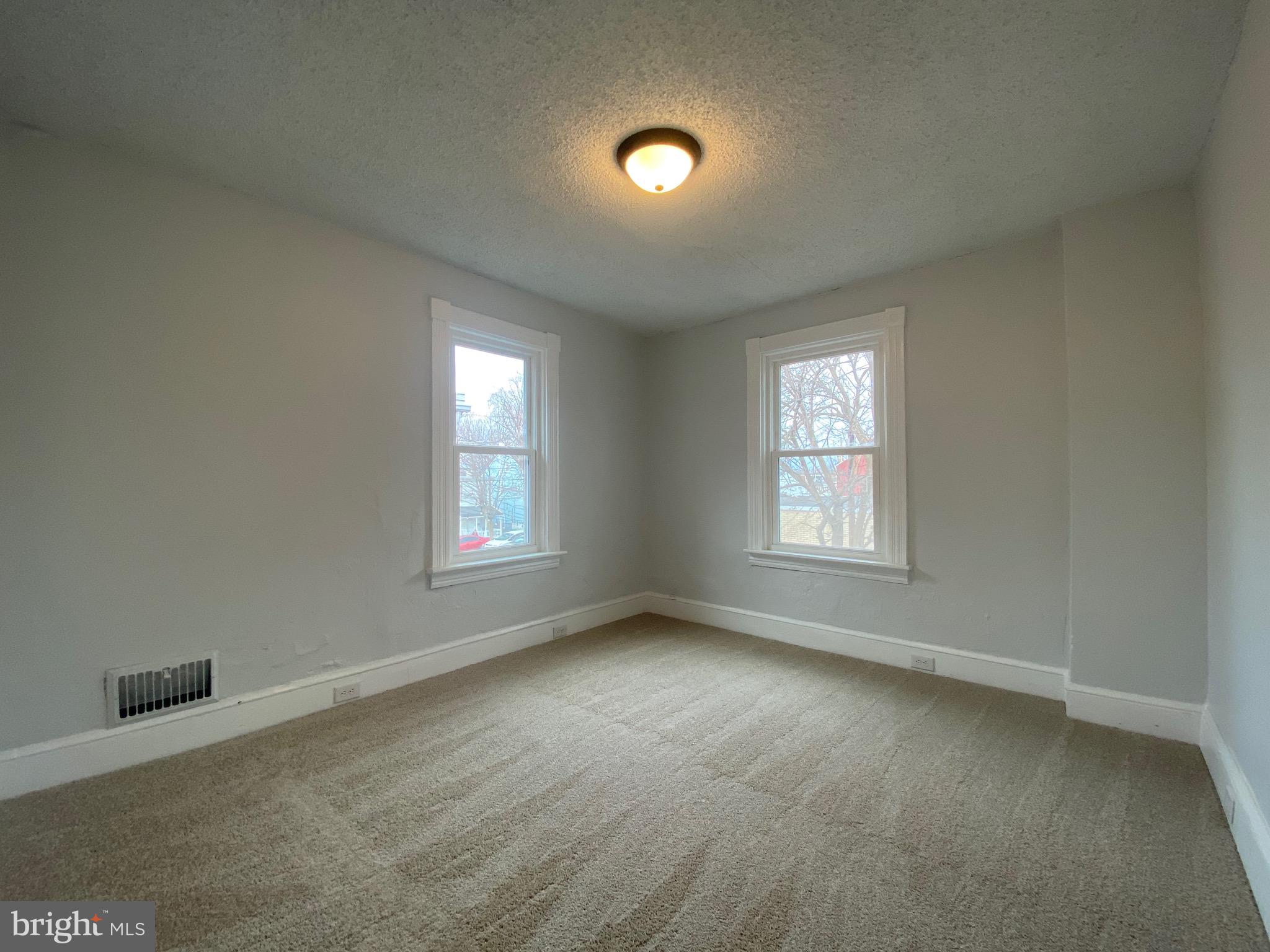 249 North Marshall Street Lancaster, PA 17602 - Photo 13 of 15 an empty room with ceiling fan and windows