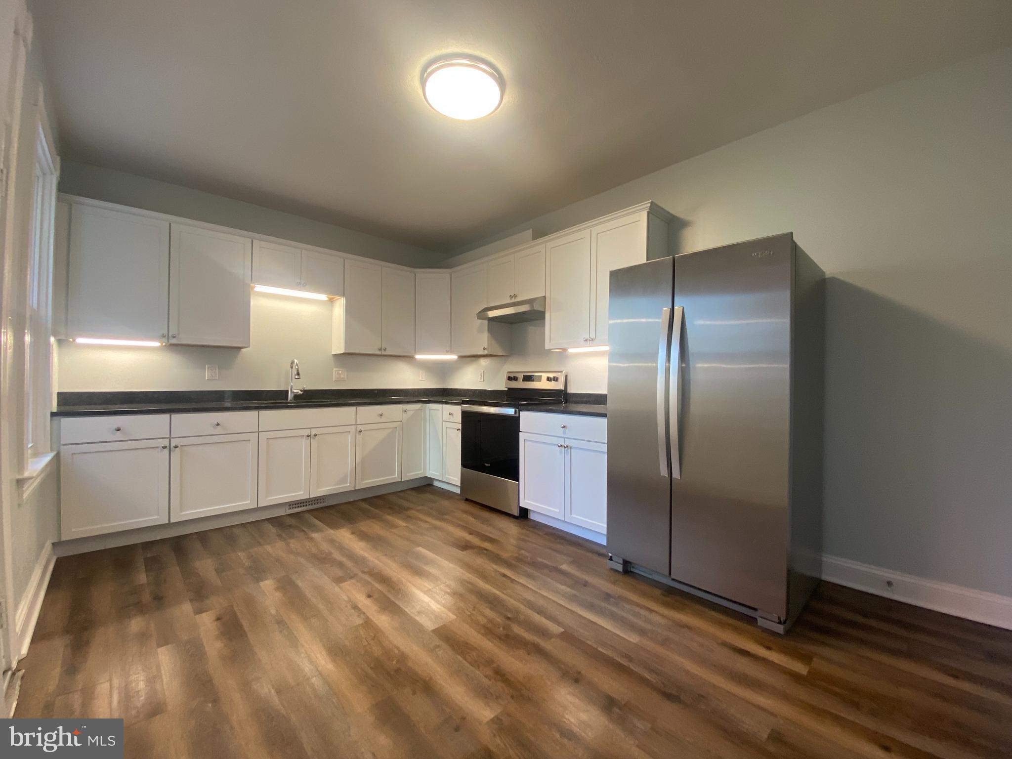 249 North Marshall Street Lancaster, PA 17602 - Photo 2 of 15 a large kitchen with cabinets